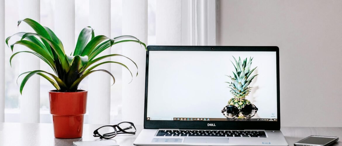 photo of laptop near plant